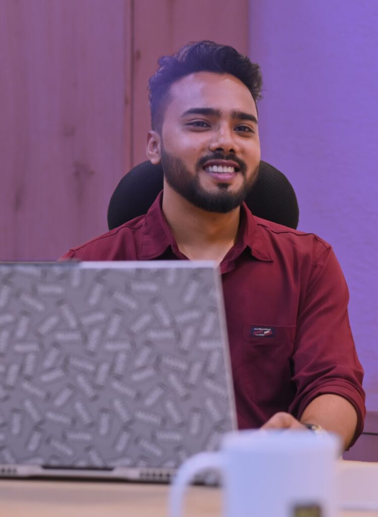 Talib, founder of Talib Studio, at his desk.